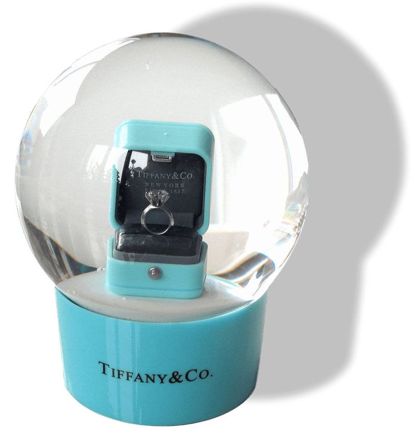 TIFFANY CO. Snow globe with a solitaire in its box. …
